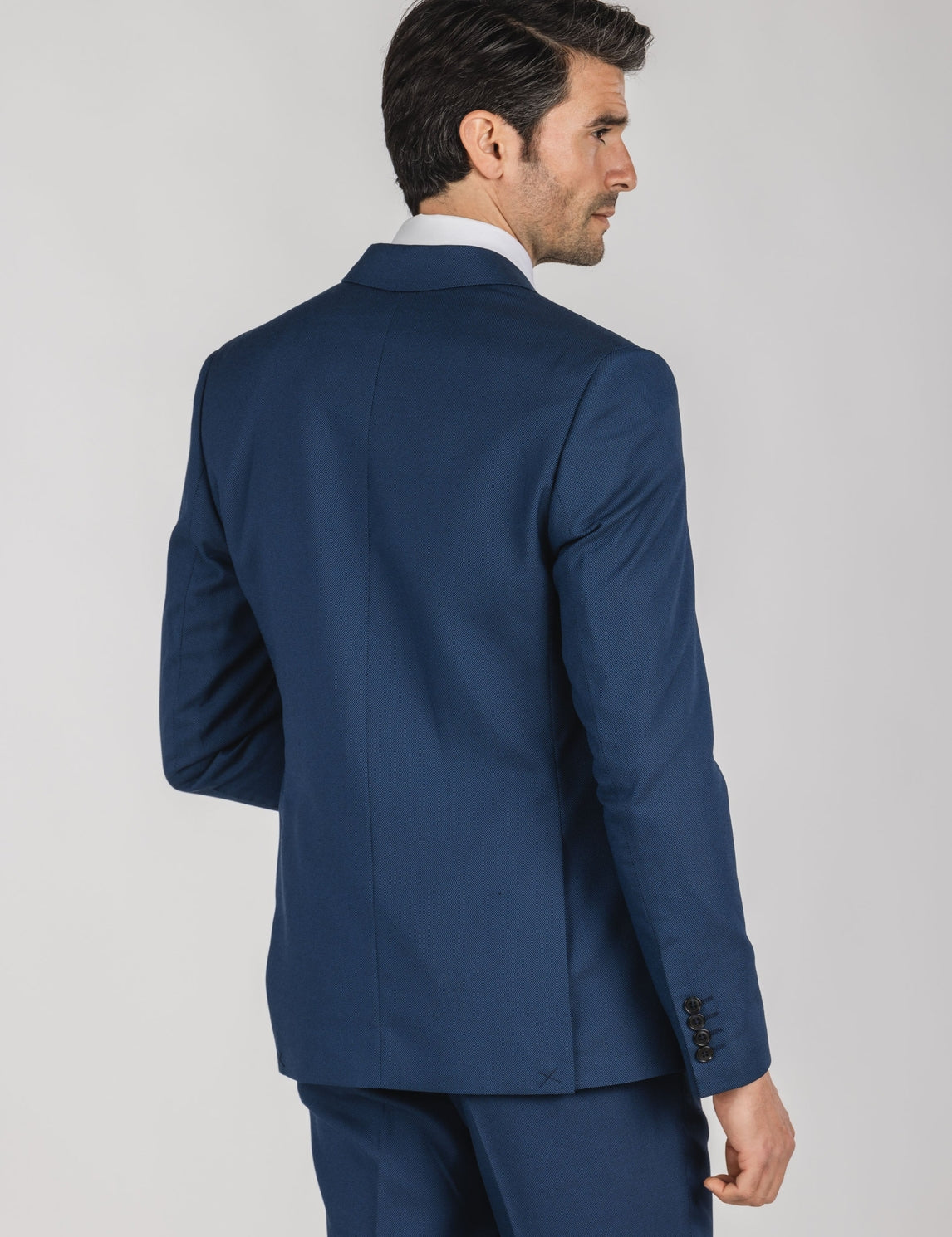 Veste de costume homme bleue à bouton central, col et rabat
